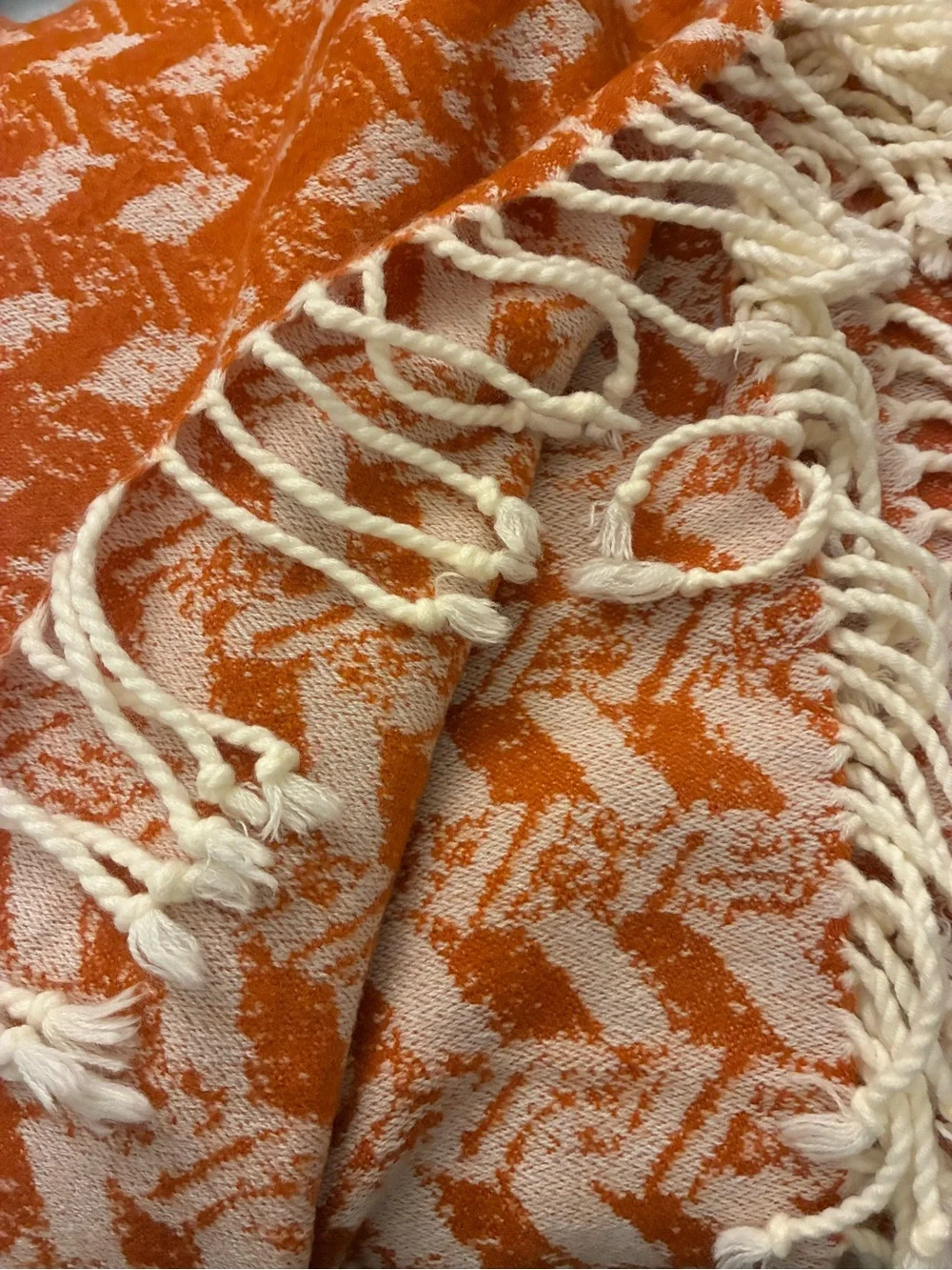 Threshold soft woven throw with knotted tassels. 60”x50”.